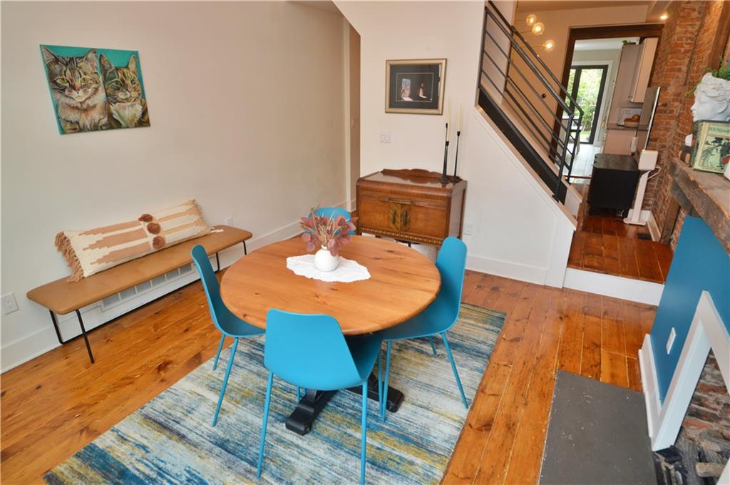 99 South 13th Street Pittsburgh, PA 15203 - Photo 5 of 50 a view of a dining room with furniture a rug and wooden floor
