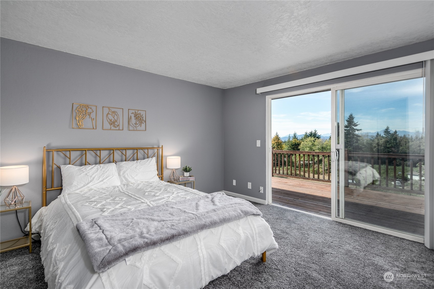 4751 Southeast Horstman Road Port Orchard, WA 98366 - Photo 16 of 40 a bedroom with a balcony and a bed