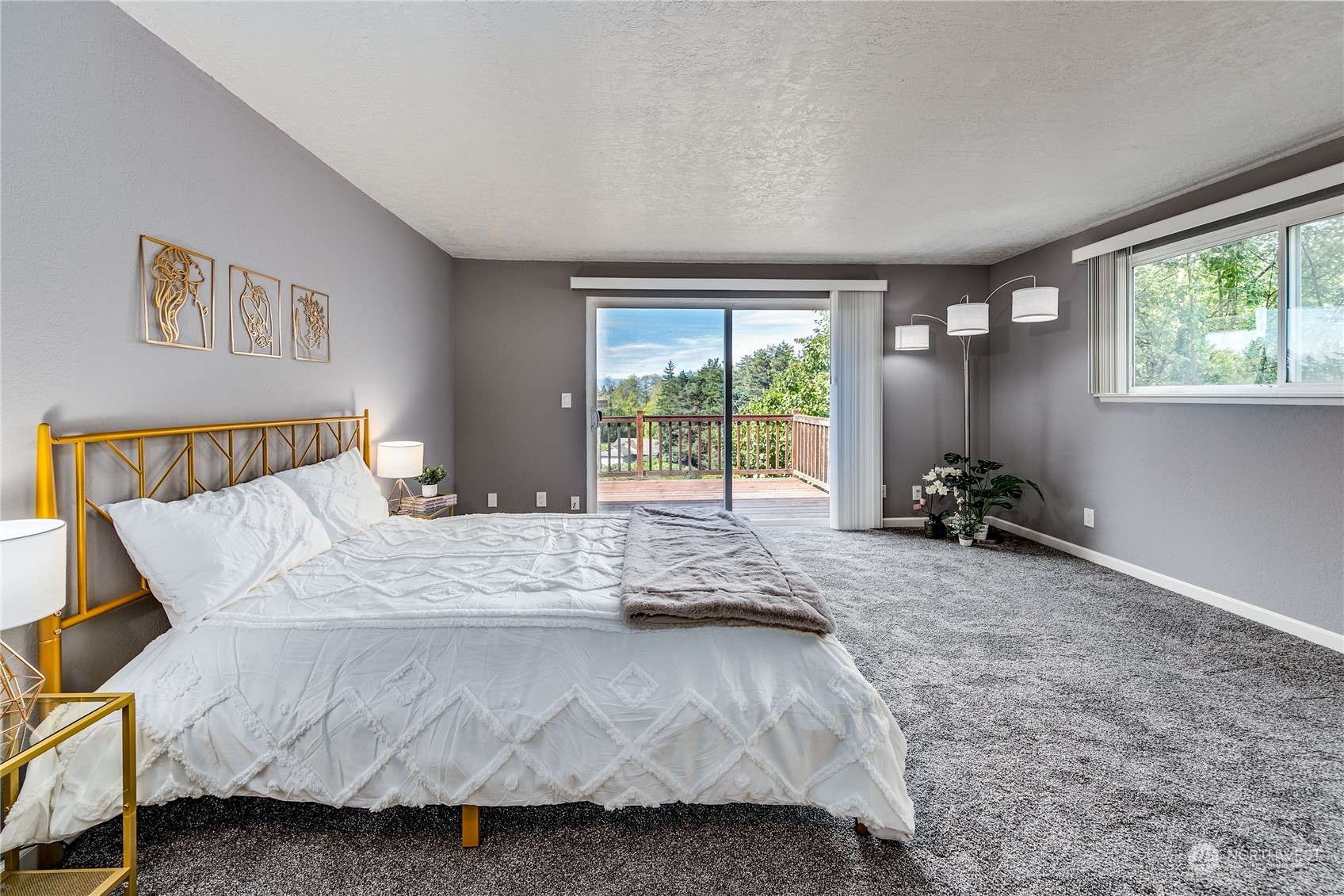 4751 Southeast Horstman Road Port Orchard, WA 98366 - Photo 17 of 40 a bedroom with a bed and a large window
