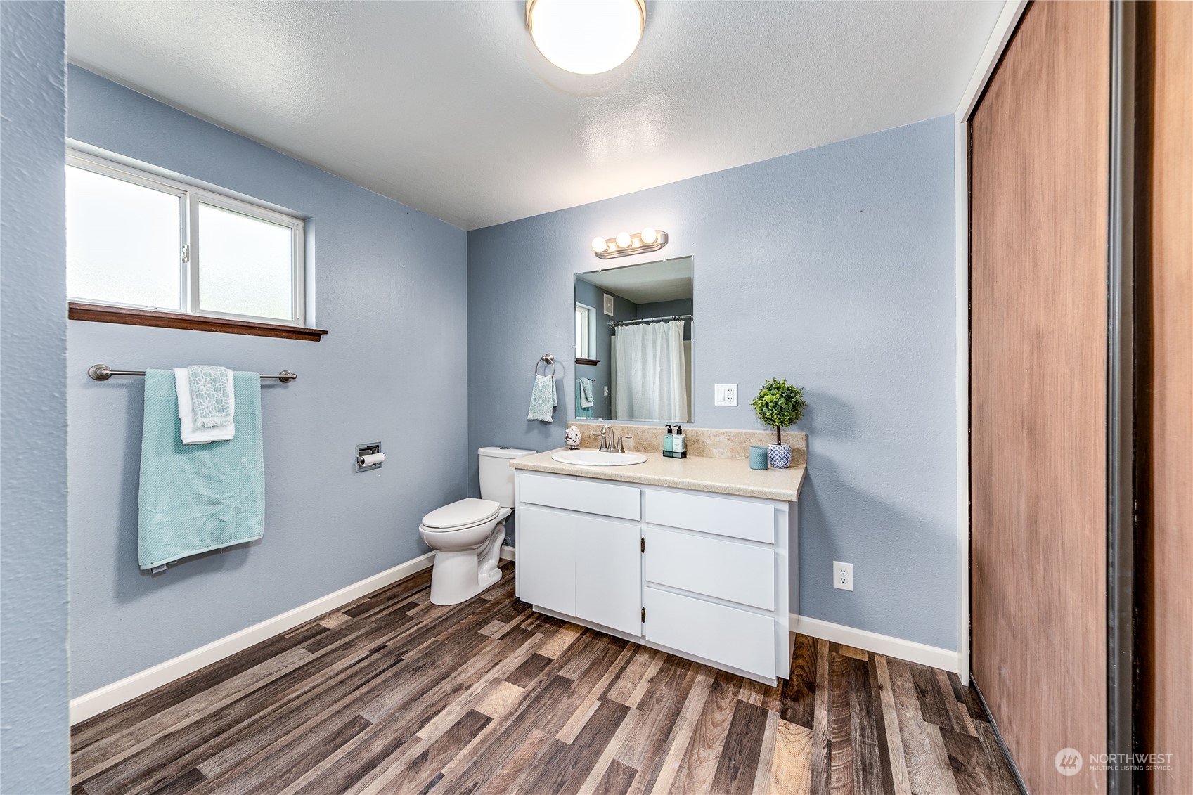 4751 Southeast Horstman Road Port Orchard, WA 98366 - Photo 20 of 40 a bathroom with a sink mirror and toilet