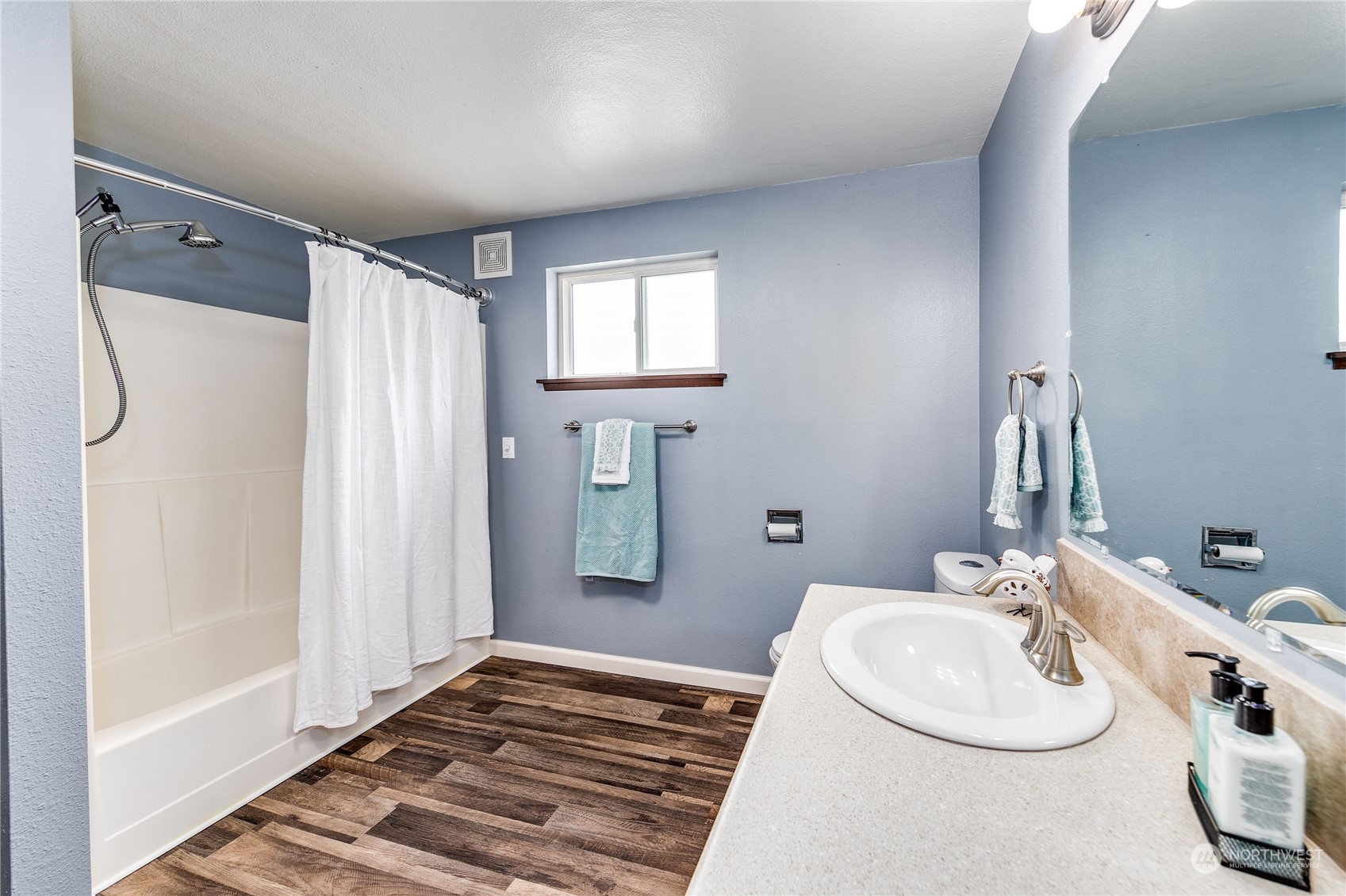 4751 Southeast Horstman Road Port Orchard, WA 98366 - Photo 21 of 40 a bathroom with a sink and a mirror