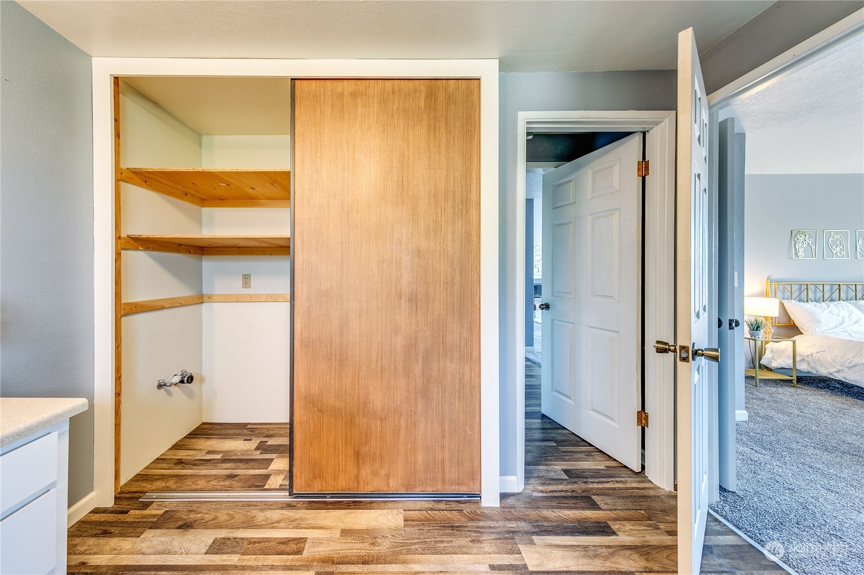 4751 Southeast Horstman Road Port Orchard, WA 98366 - Photo 23 of 40 a view of a livingroom with wooden floor and a ceiling fan