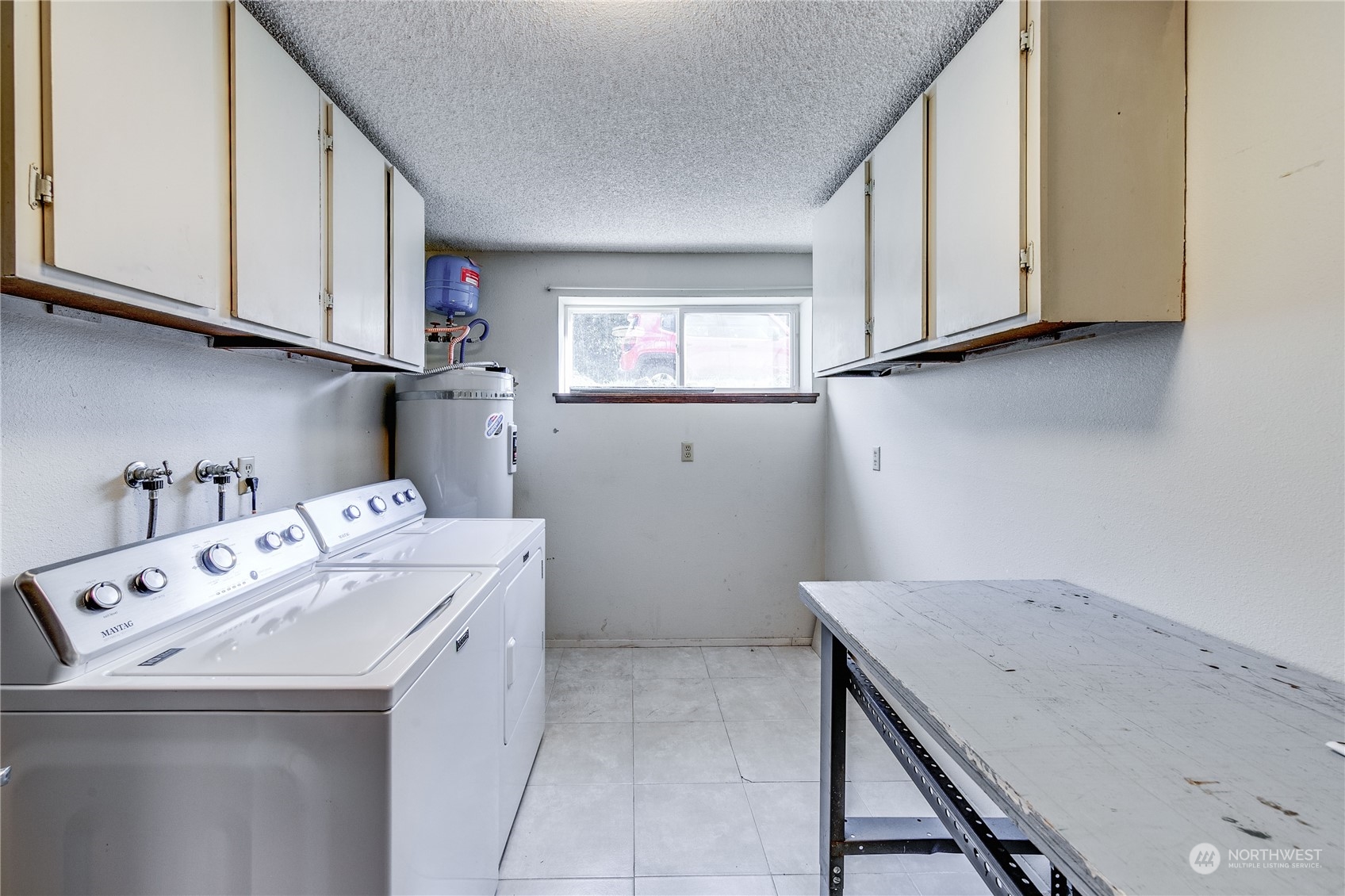 4751 Southeast Horstman Road Port Orchard, WA 98366 - Photo 24 of 40 a utility room with cabinets washer and dryer