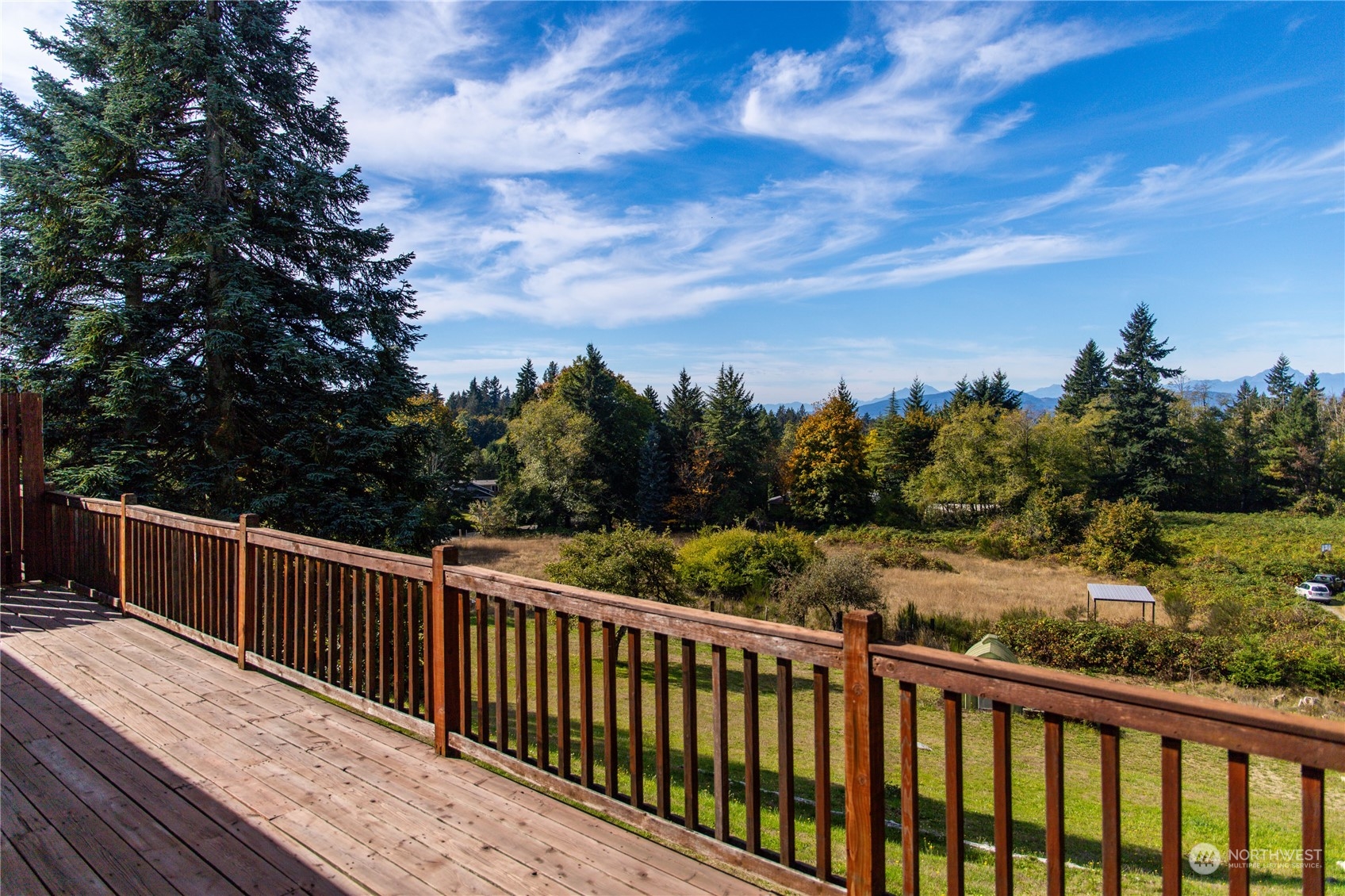 4751 Southeast Horstman Road Port Orchard, WA 98366 - Photo 25 of 40 a view of a balcony with wooden fence