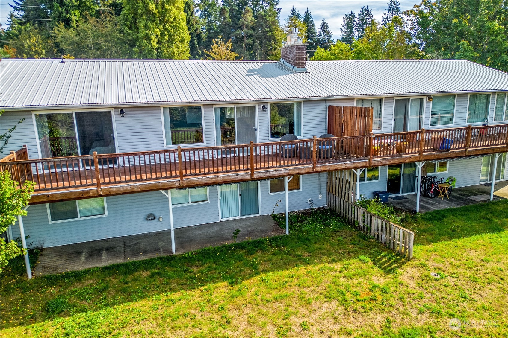 4751 Southeast Horstman Road Port Orchard, WA 98366 - Photo 3 of 40 a view of an house with backyard space and balcony