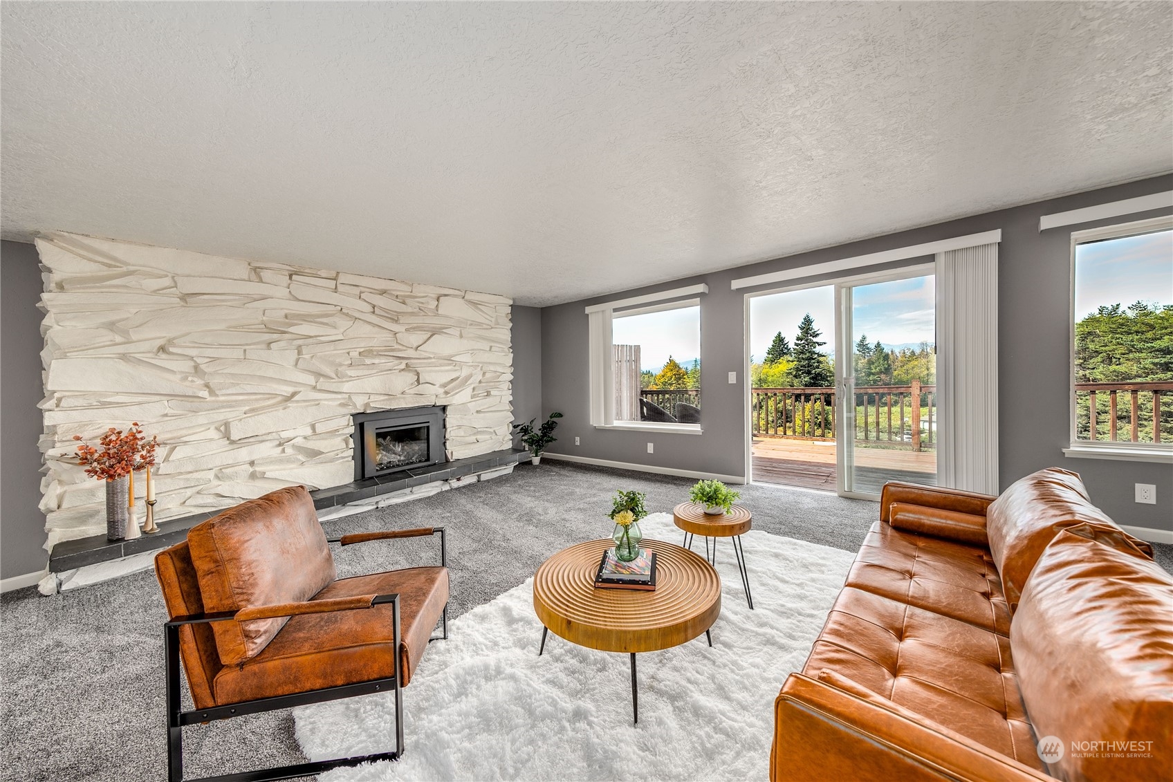 4751 Southeast Horstman Road Port Orchard, WA 98366 - Photo 8 of 40 a living room with furniture and a fireplace