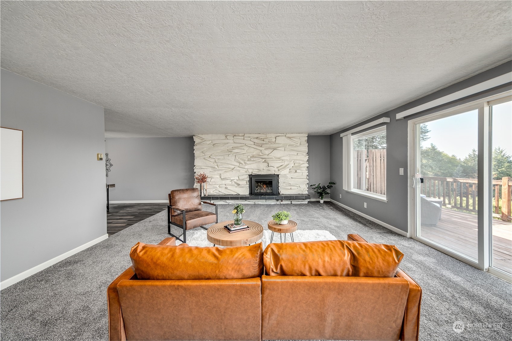 4751 Southeast Horstman Road Port Orchard, WA 98366 - Photo 9 of 40 a living room with furniture potted plant and a large window