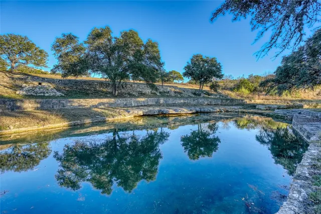 a view of a lake with a yard