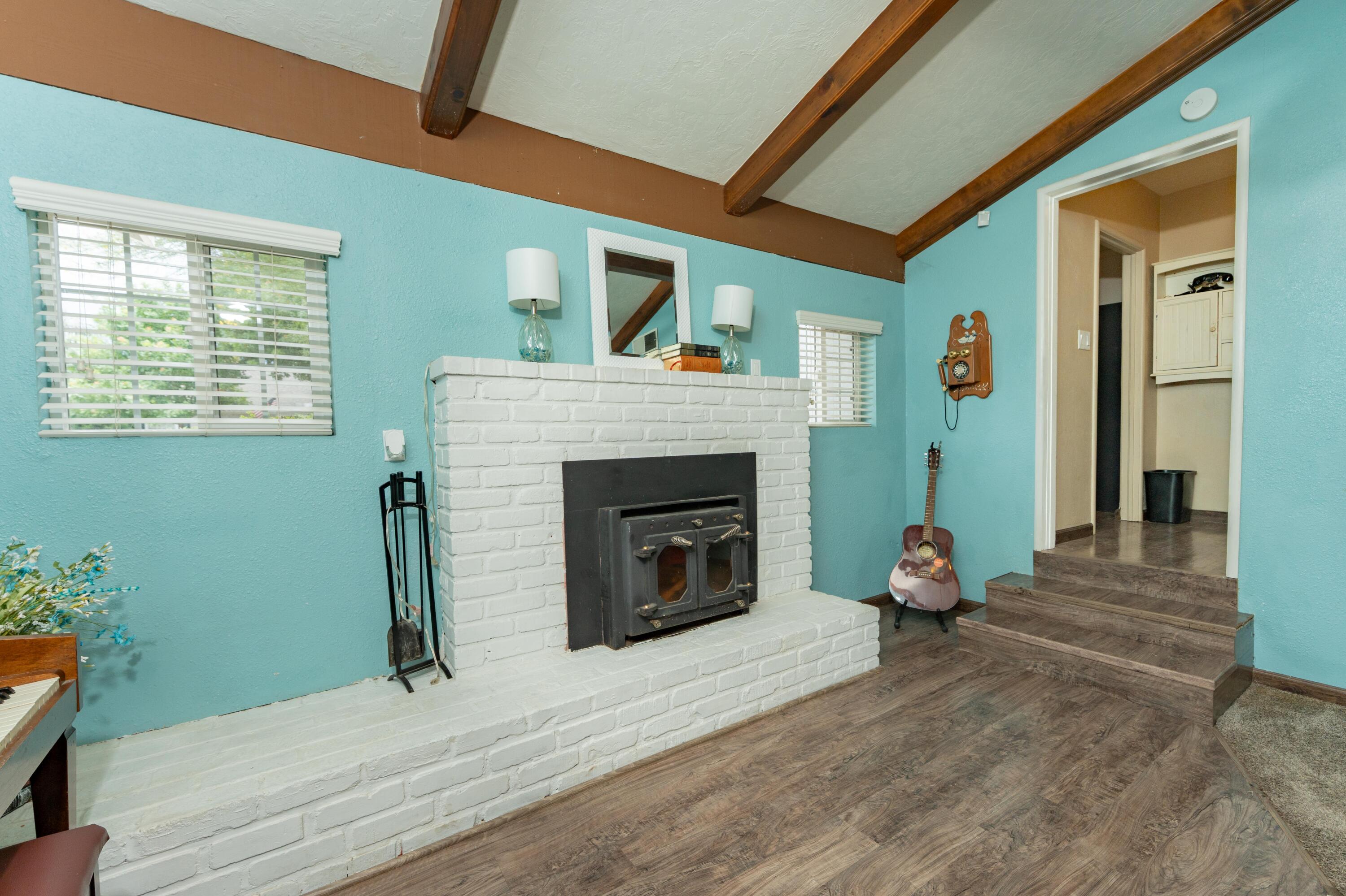 570 North Birch Avenue Reedley, CA 93654 - Photo 25 of 52 a living room with furniture and a fireplace
