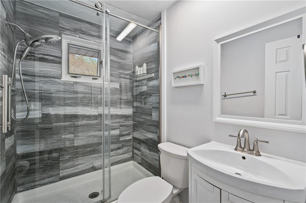 5431 Hamilton Road Gibsonia, PA 15044 - Photo 17 of 28 a bathroom with a sink toilet and shower
