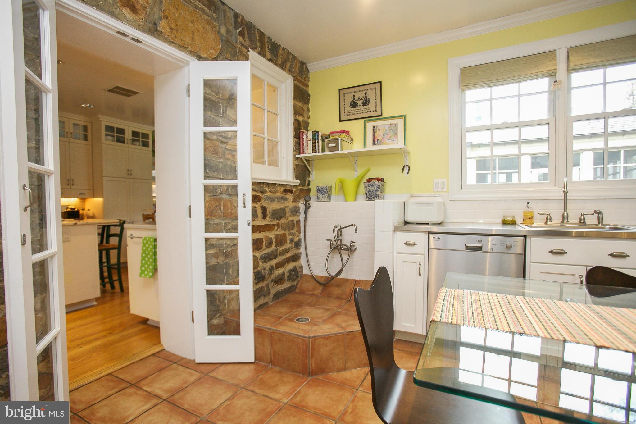 214 Goodale Road Baltimore, MD 21212 - Photo 11 of 30 a living room filled with furniture windows and a chandelier