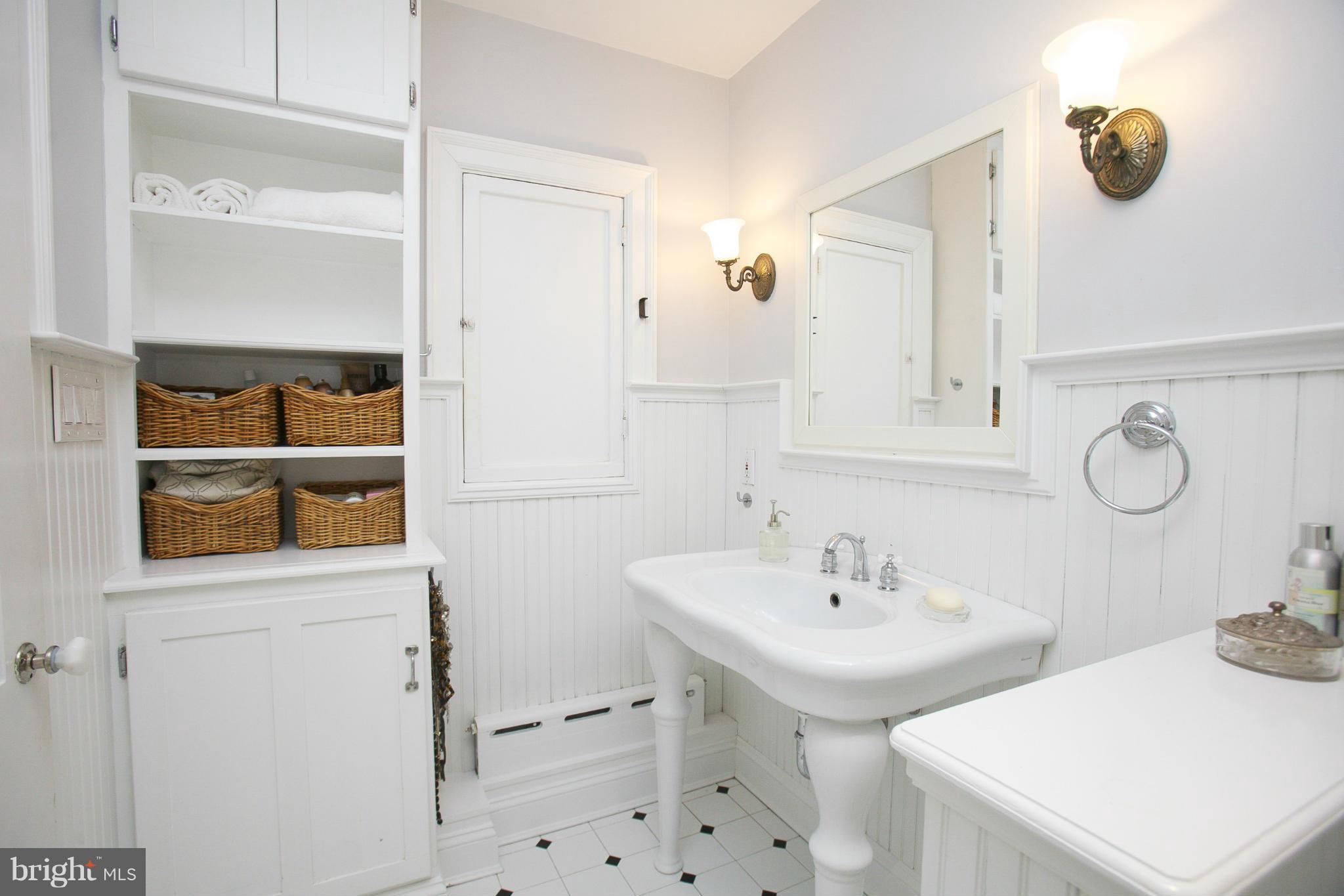 214 Goodale Road Baltimore, MD 21212 - Photo 18 of 30 a bathroom with a sink and a mirror