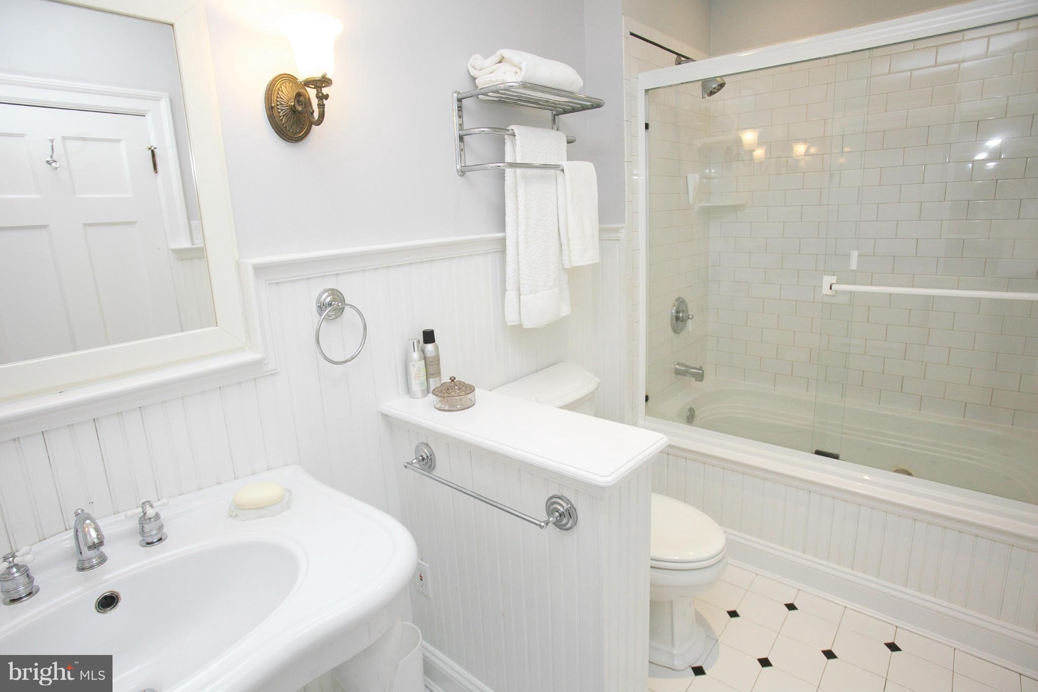 214 Goodale Road Baltimore, MD 21212 - Photo 19 of 30 a bathroom with a sink a toilet and shower