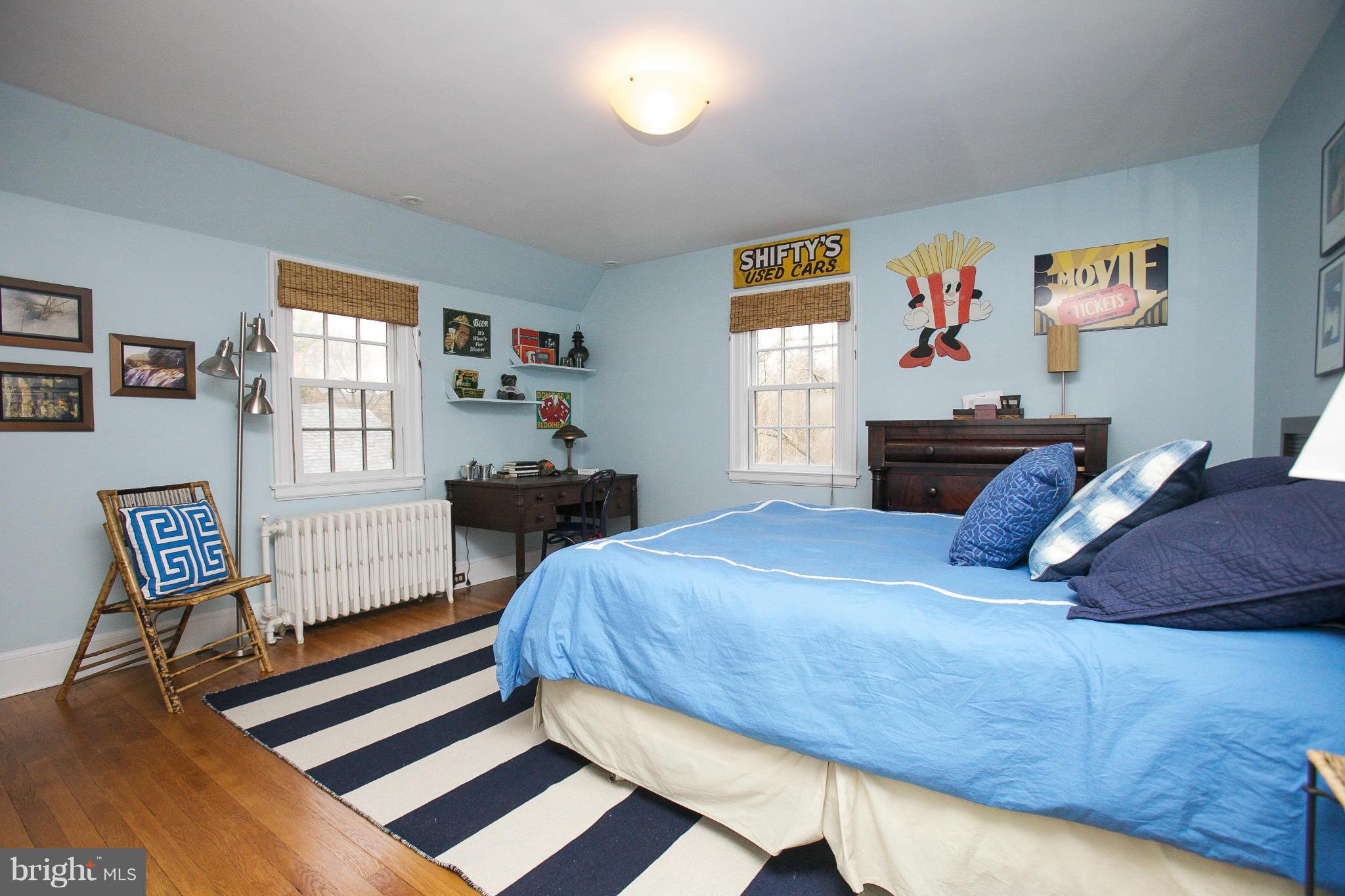214 Goodale Road Baltimore, MD 21212 - Photo 20 of 30 a bedroom with a bed and wooden floor