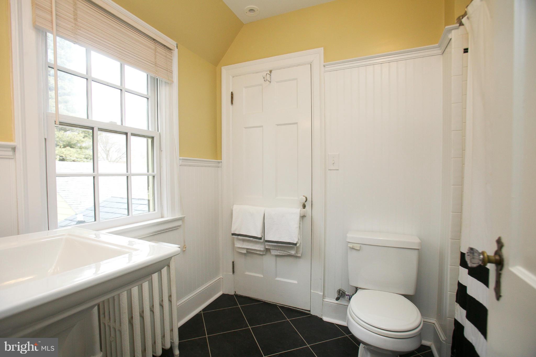 214 Goodale Road Baltimore, MD 21212 - Photo 22 of 30 a bathroom with a sink a toilet and a shower