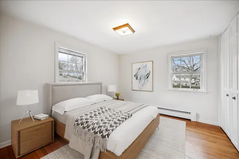 a bedroom with a bed and a lamp