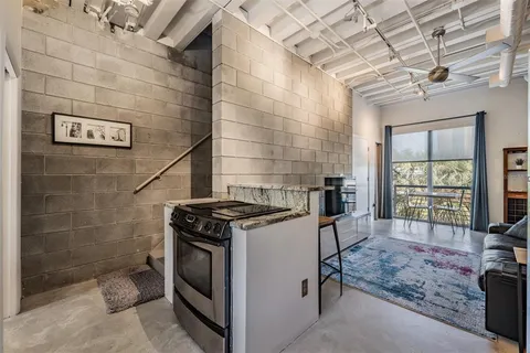 a kitchen with cabinets and stainless steel appliances