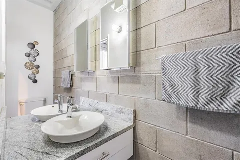 a view of a patio with a table and chairs