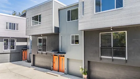 a view of a house with car parked