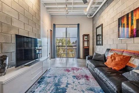 a living room with a couch and a flat screen tv