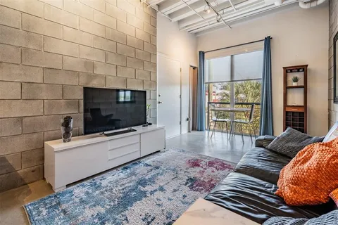 a room that has a dresser and a window in it