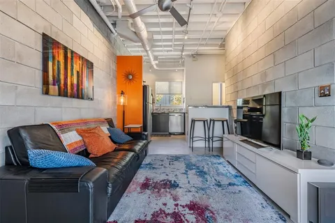 a kitchen with a stove and refrigerator