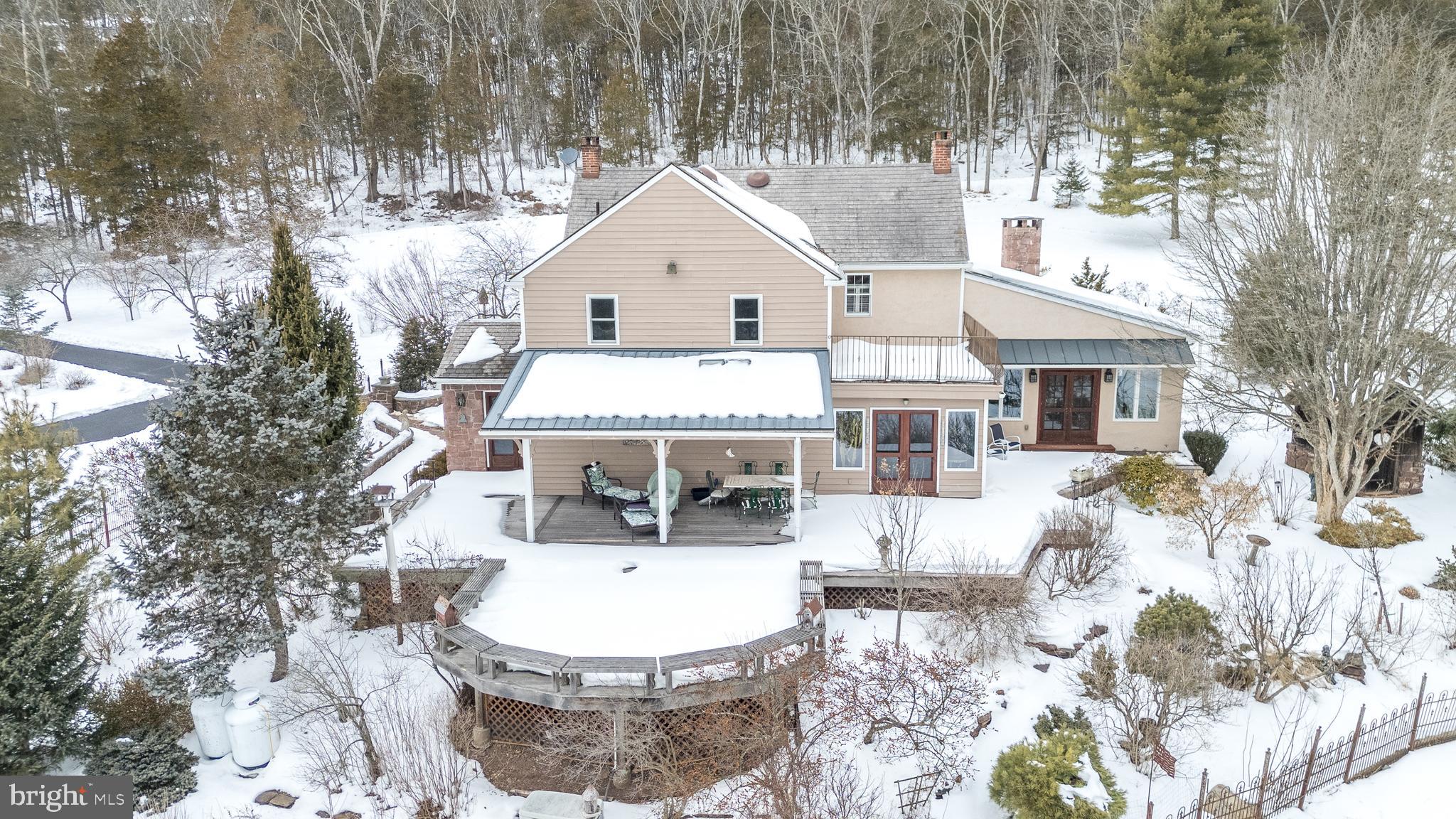 23 Lily Valley Road Erwinna, PA 18920 - Photo 15 of 81 a view of a house with backyard and sitting area