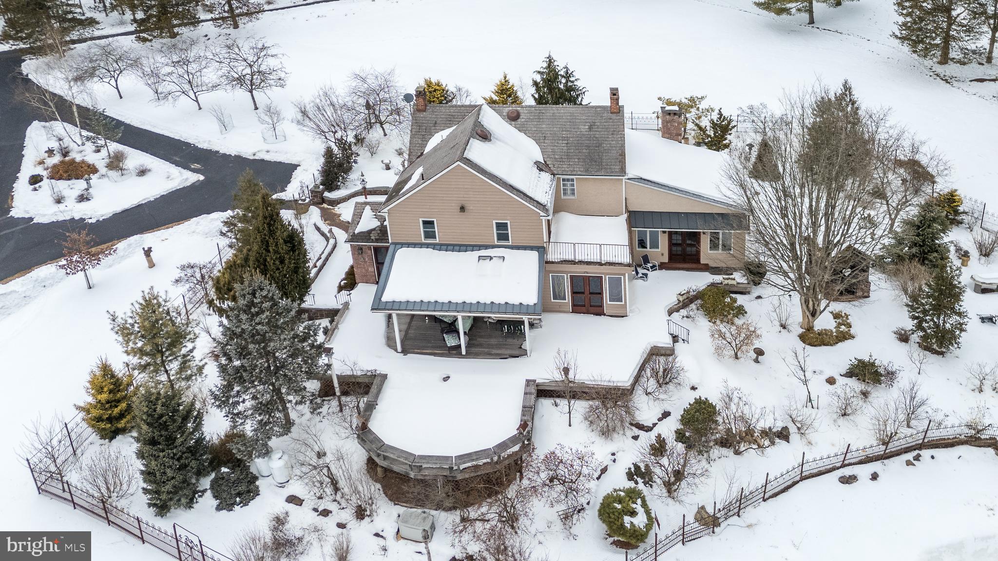 23 Lily Valley Road Erwinna, PA 18920 - Photo 20 of 81 a view of a white house with a yard and sitting area