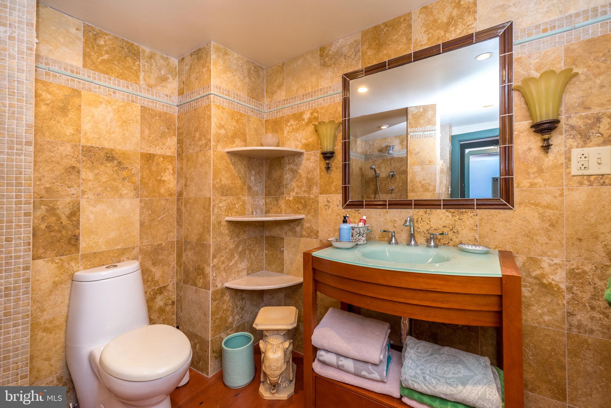 23 Lily Valley Road Erwinna, PA 18920 - Photo 27 of 81 a bathroom with a sink toilet and mirror