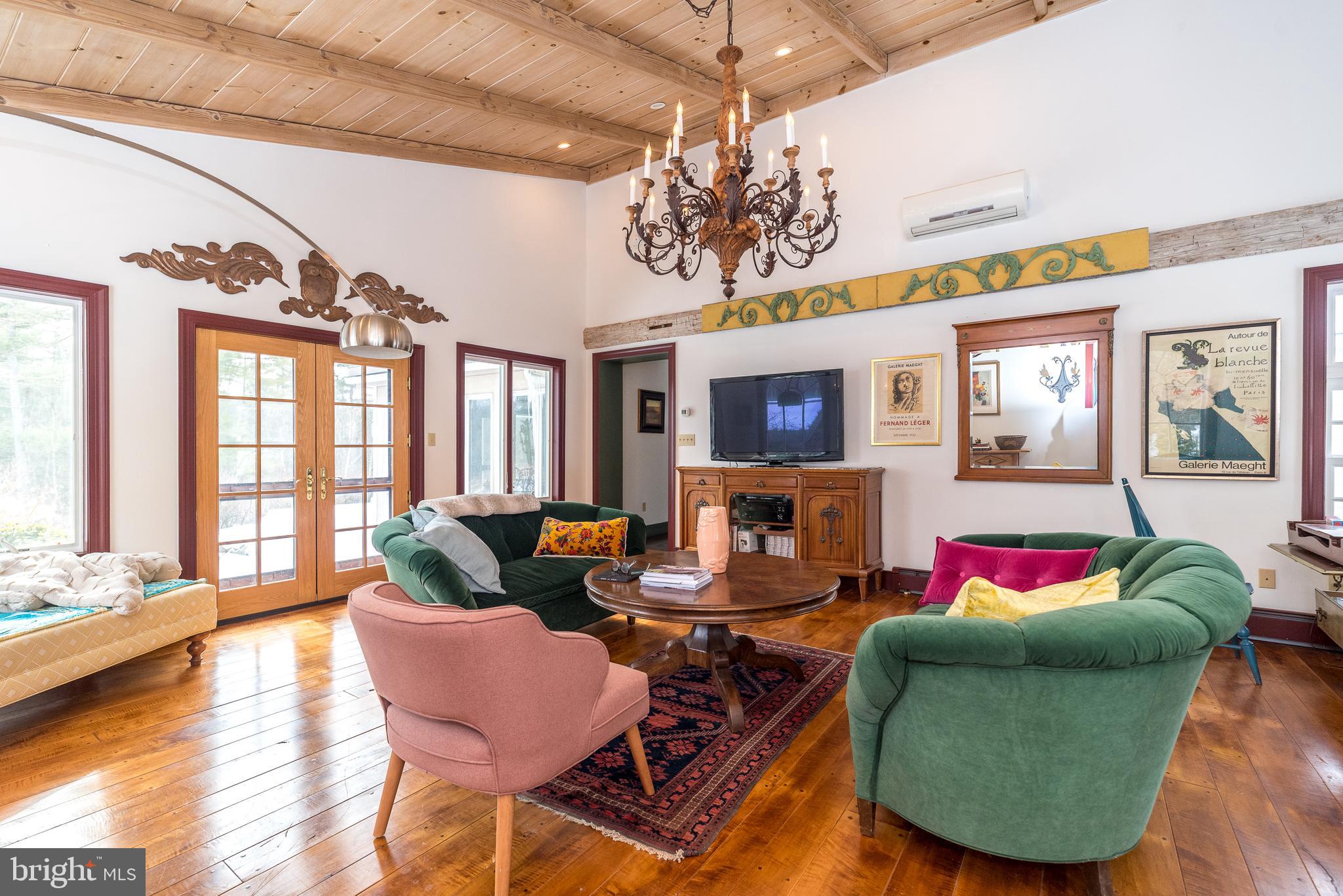 23 Lily Valley Road Erwinna, PA 18920 - Photo 33 of 81 a living room with furniture and a large window