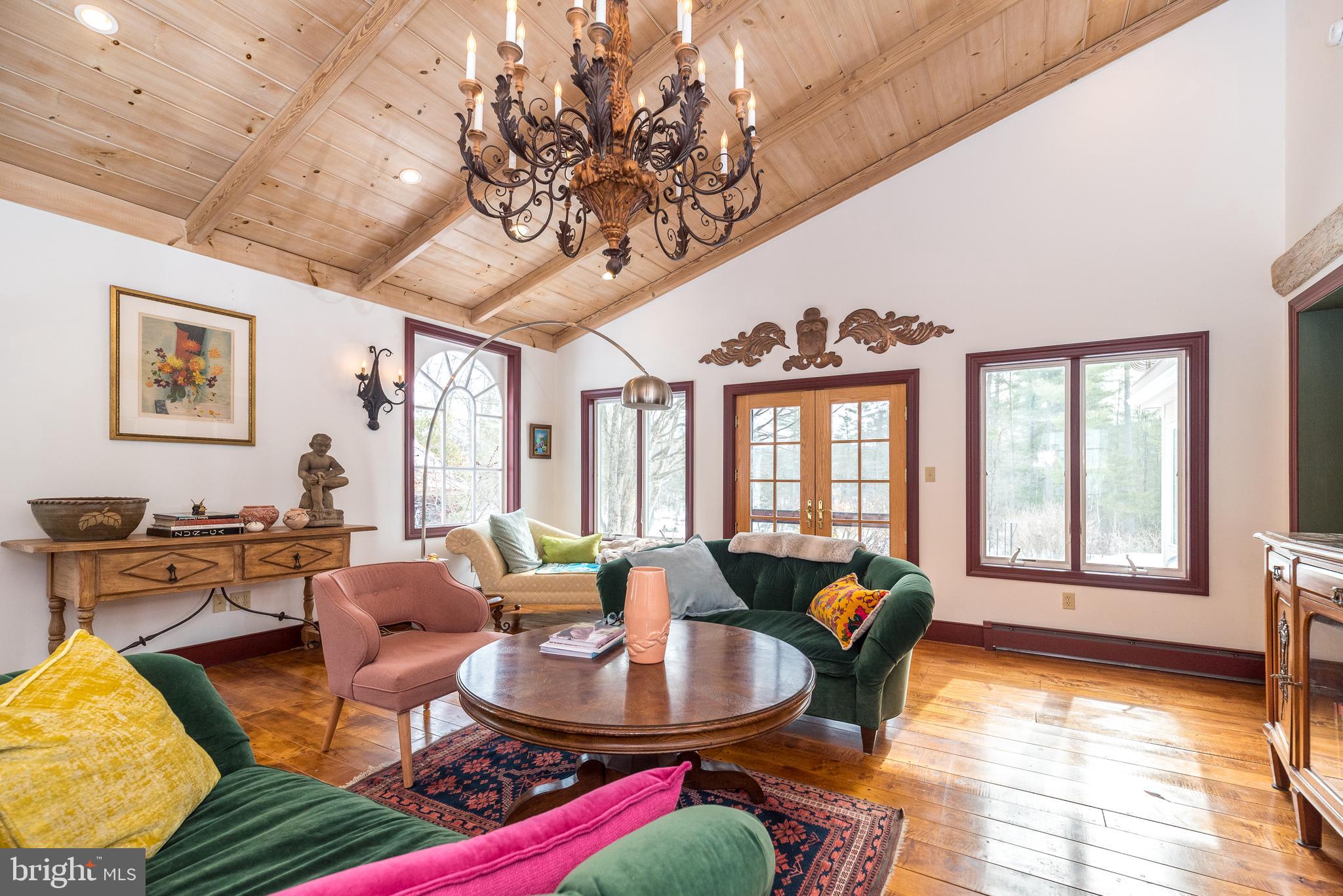 23 Lily Valley Road Erwinna, PA 18920 - Photo 34 of 81 a living room with fireplace furniture and a large window