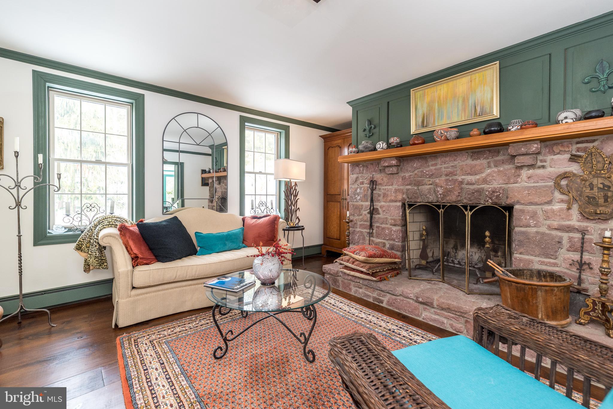 23 Lily Valley Road Erwinna, PA 18920 - Photo 36 of 81 a living room with furniture and a fireplace