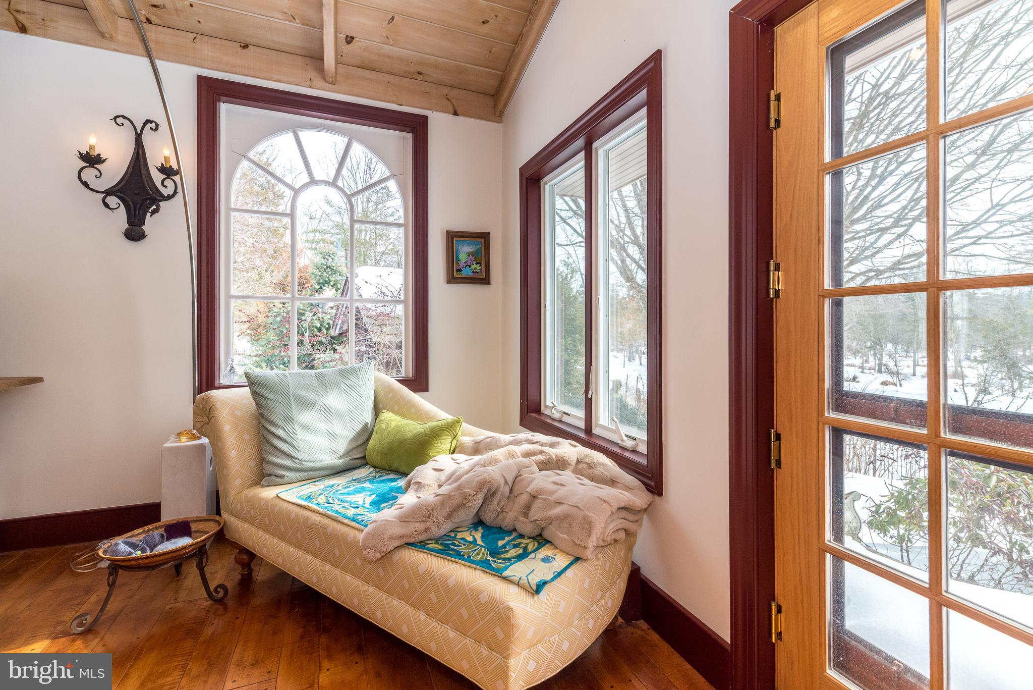 23 Lily Valley Road Erwinna, PA 18920 - Photo 39 of 81 a living room with furniture and a window
