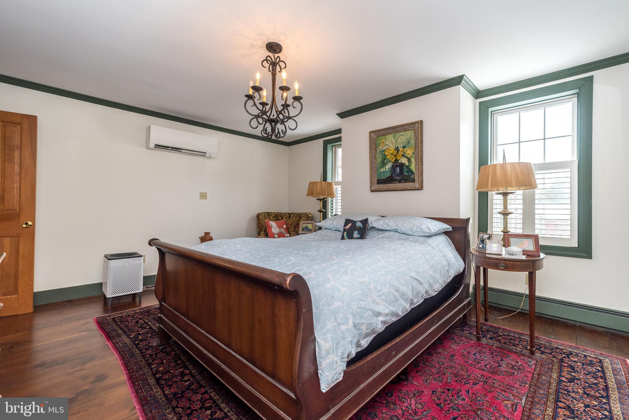 23 Lily Valley Road Erwinna, PA 18920 - Photo 41 of 81 a bedroom with a bed and wooden floor