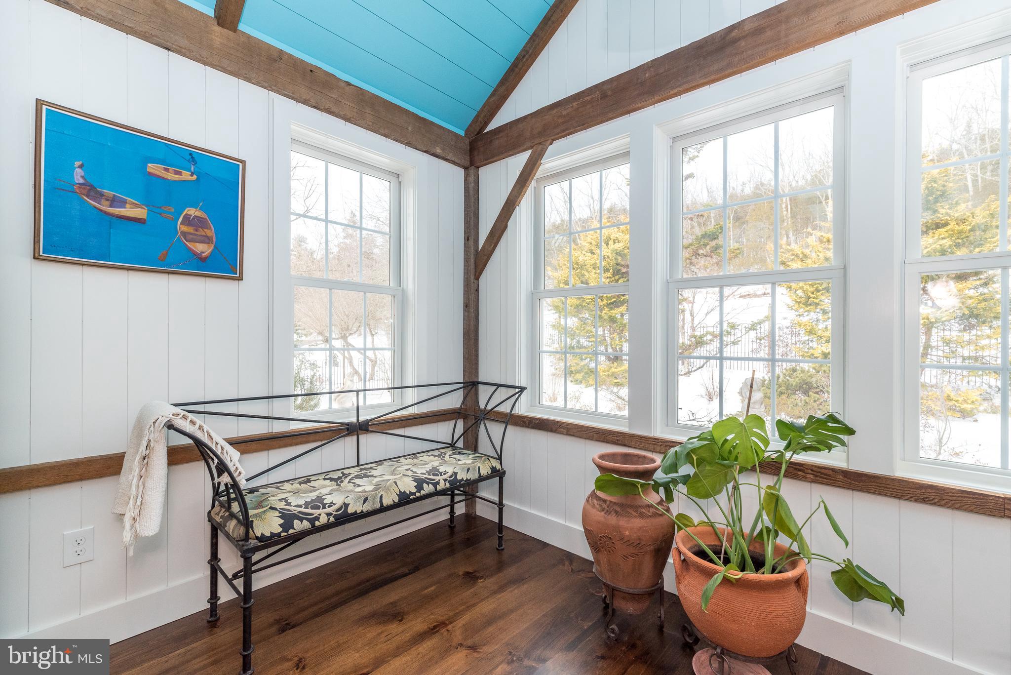 23 Lily Valley Road Erwinna, PA 18920 - Photo 42 of 81 a bedroom with furniture and a potted plant