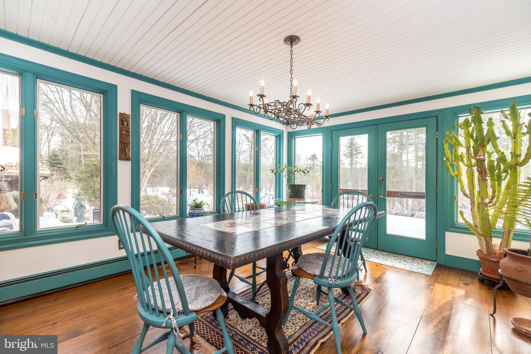 23 Lily Valley Road Erwinna, PA 18920 - Photo 49 of 81 a view of a dining room with furniture window and wooden floor