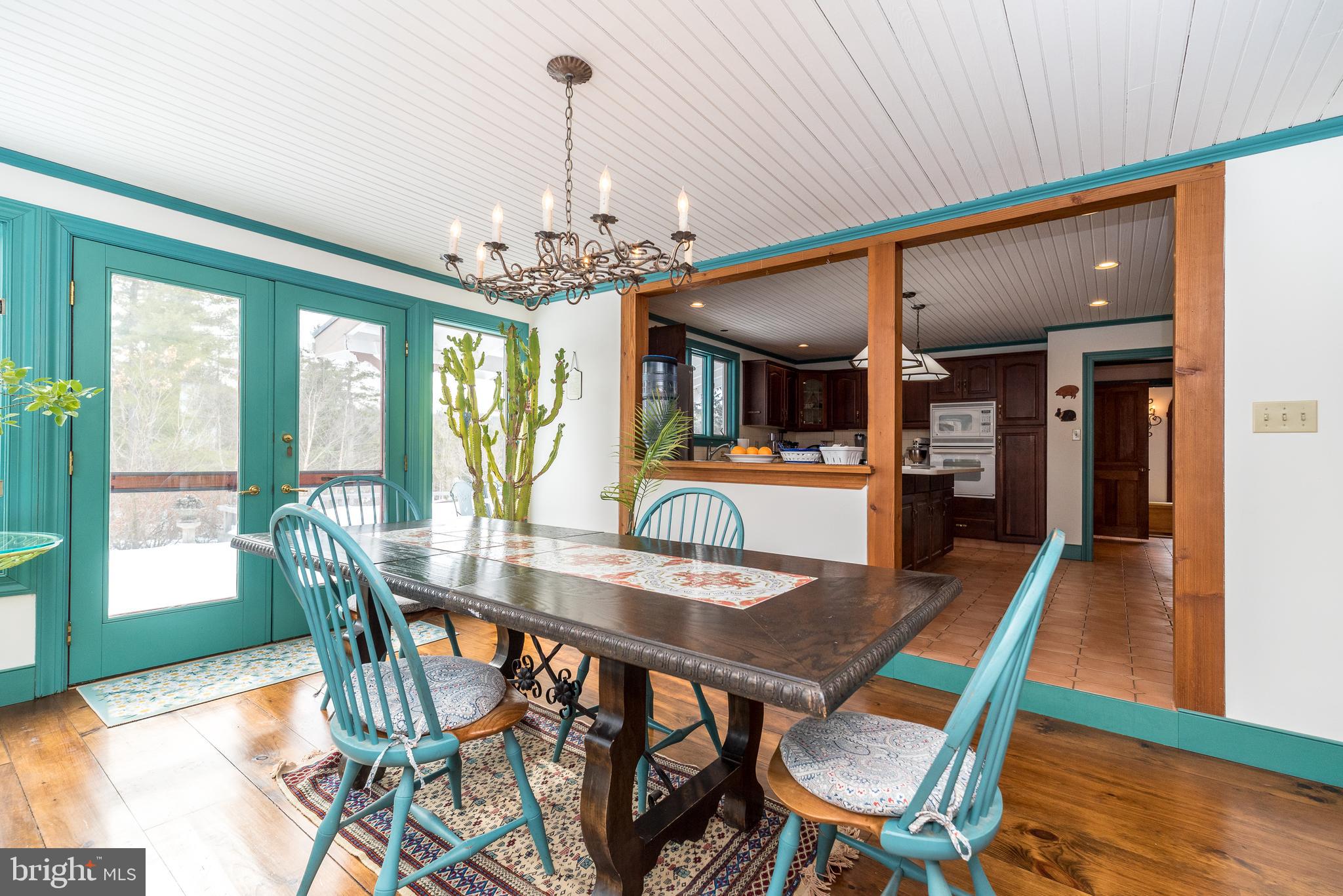23 Lily Valley Road Erwinna, PA 18920 - Photo 50 of 81 a view of a dining room with furniture window and wooden floor