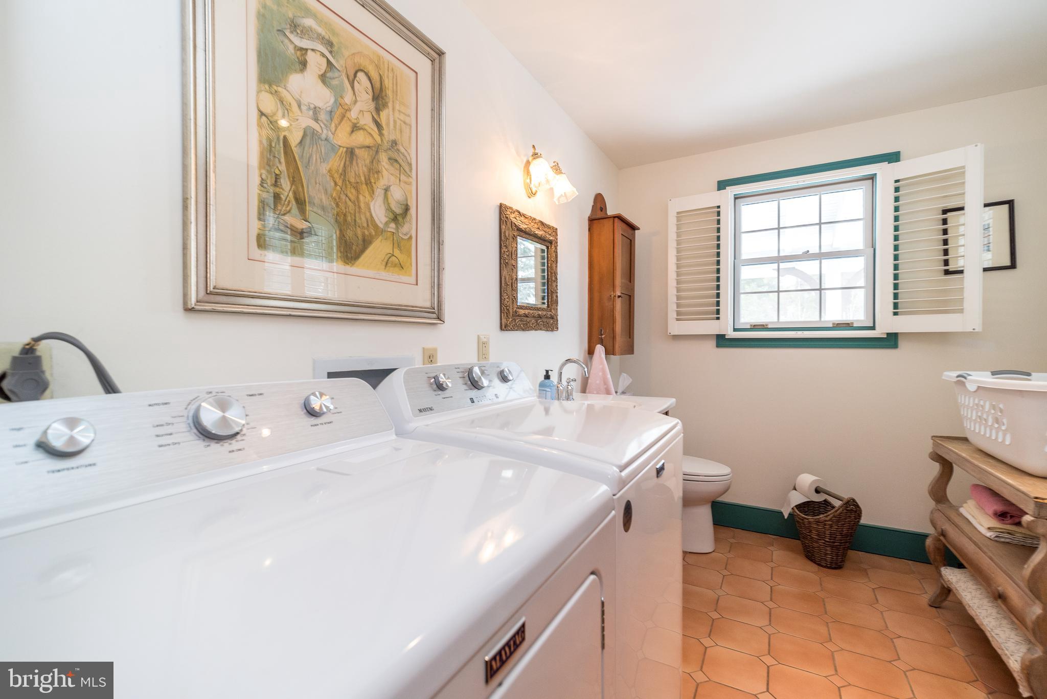 23 Lily Valley Road Erwinna, PA 18920 - Photo 58 of 81 a bathroom with double vanity sinks a mirror and a window