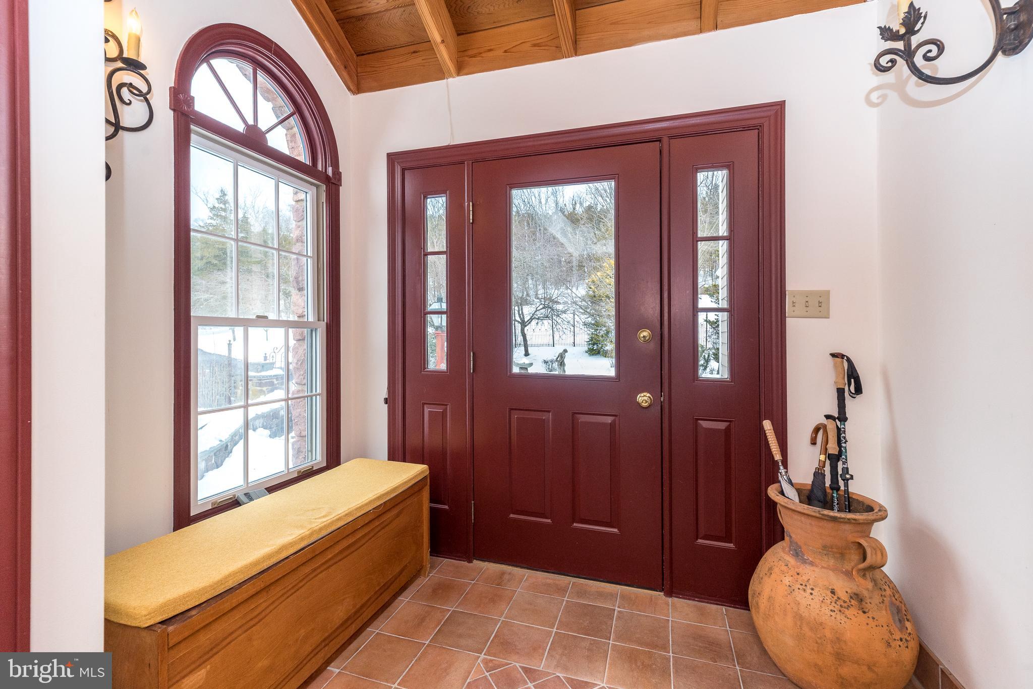 23 Lily Valley Road Erwinna, PA 18920 - Photo 61 of 81 a view of front door with furniture and a window