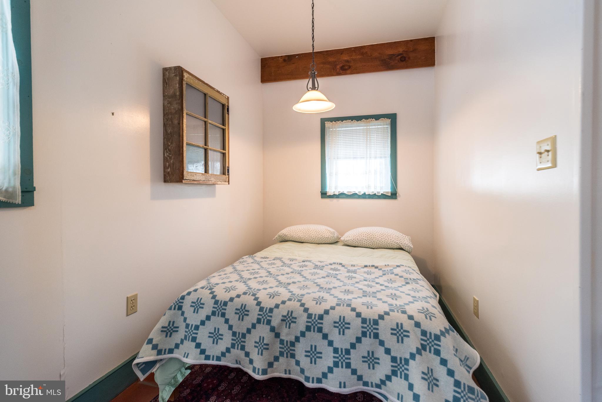 23 Lily Valley Road Erwinna, PA 18920 - Photo 69 of 81 a bedroom with a bed and a window