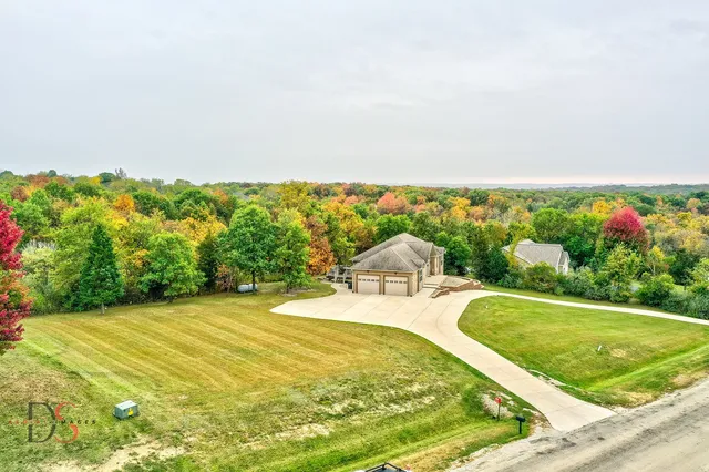 a view of a swimming pool with a yard