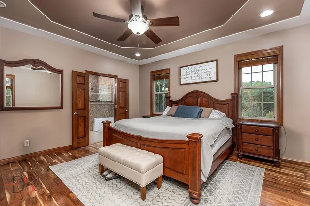 a bedroom with a large bed and a window