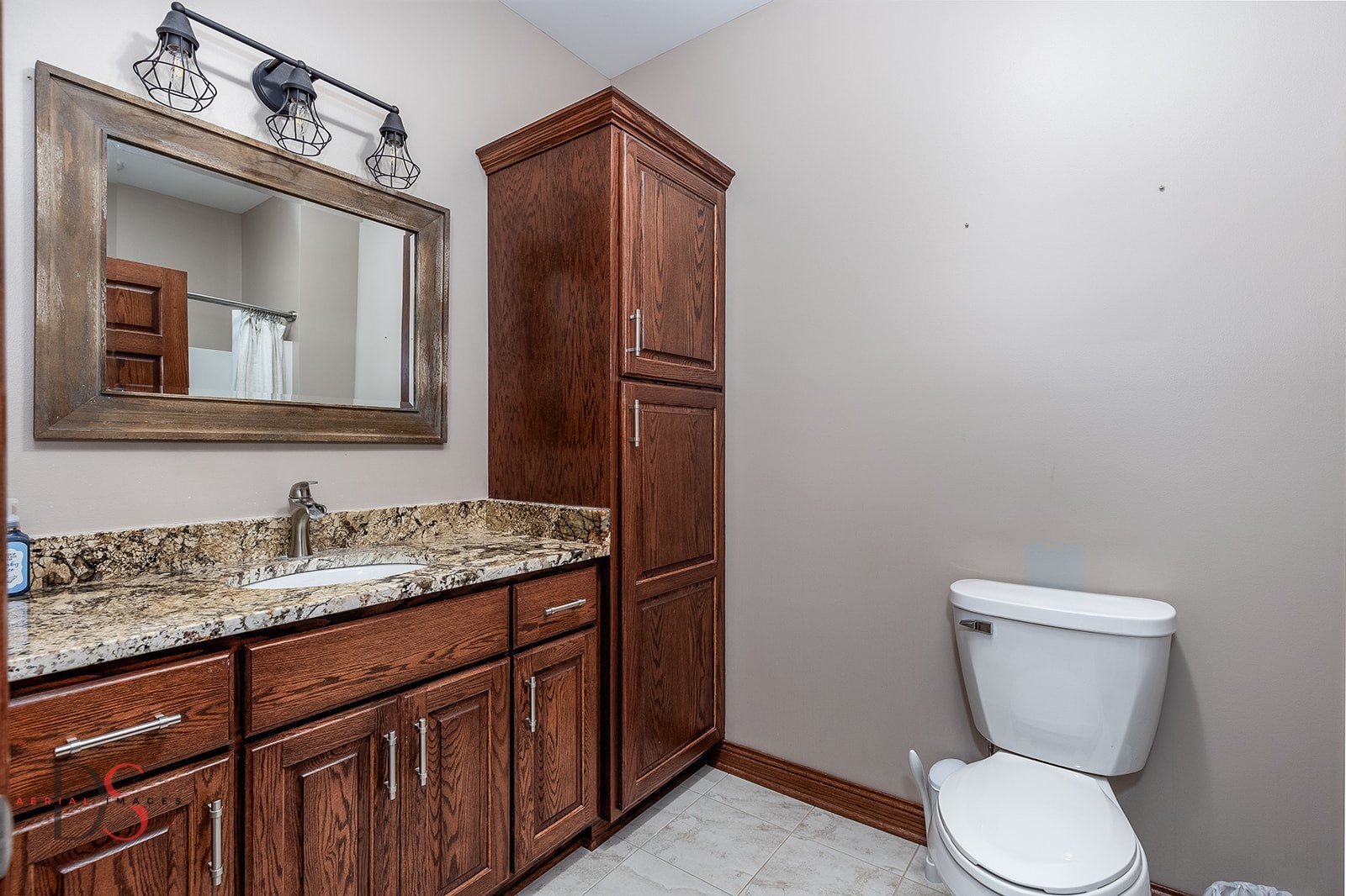 2834 East 2525th Road Marseilles, IL 61341 - Photo 22 of 31 a bathroom with a toilet sink and mirror