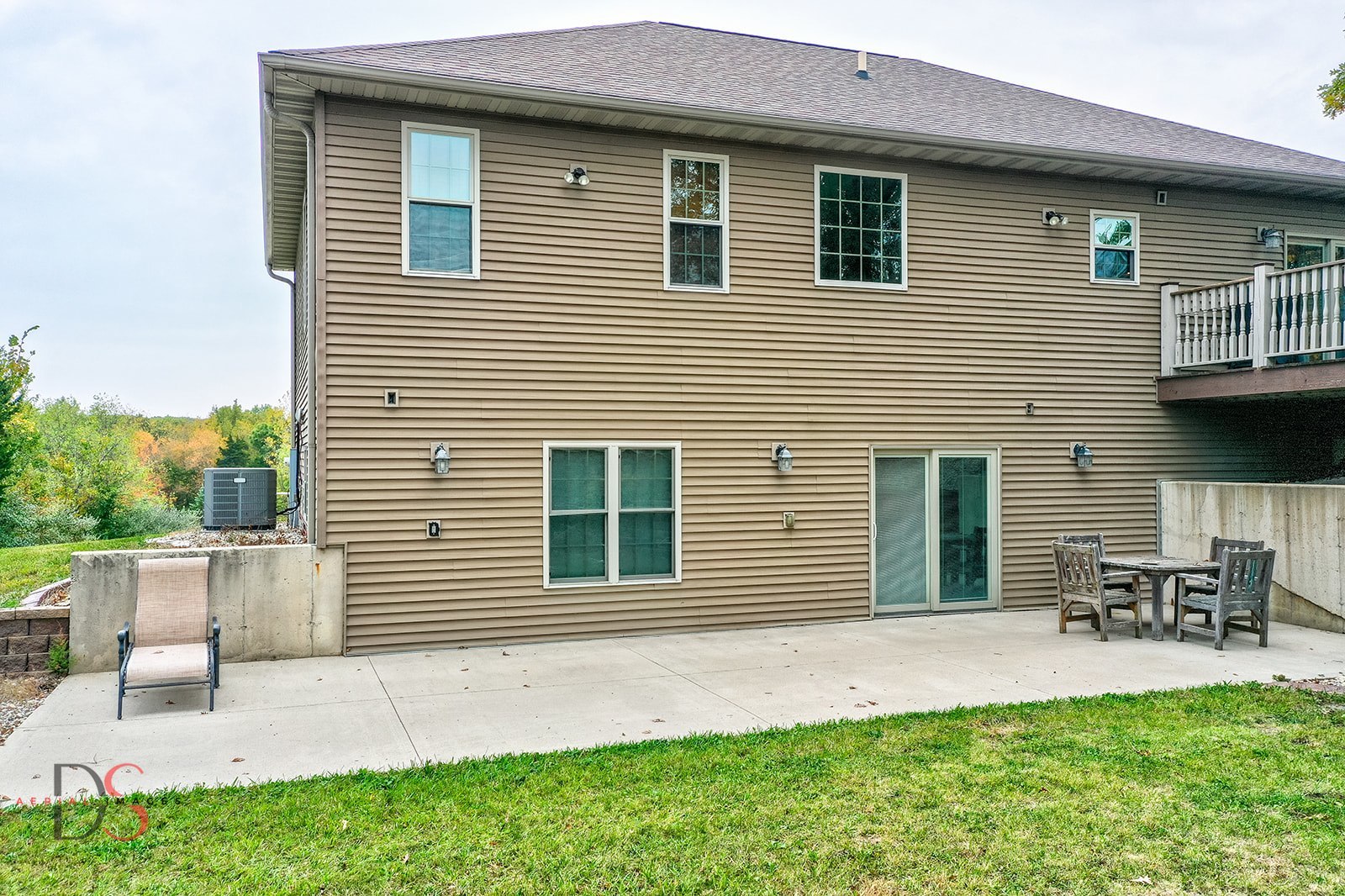 2834 East 2525th Road Marseilles, IL 61341 - Photo 9 of 31 a brick house with a yard and table and chairs next to window