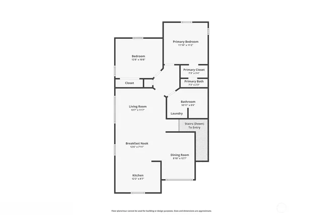 a view of a house with table and chairs under an umbrella