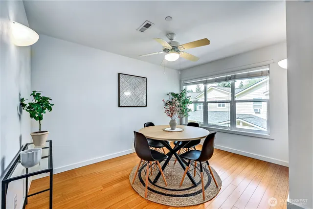 a view of a dining room with furniture window and wooden floor