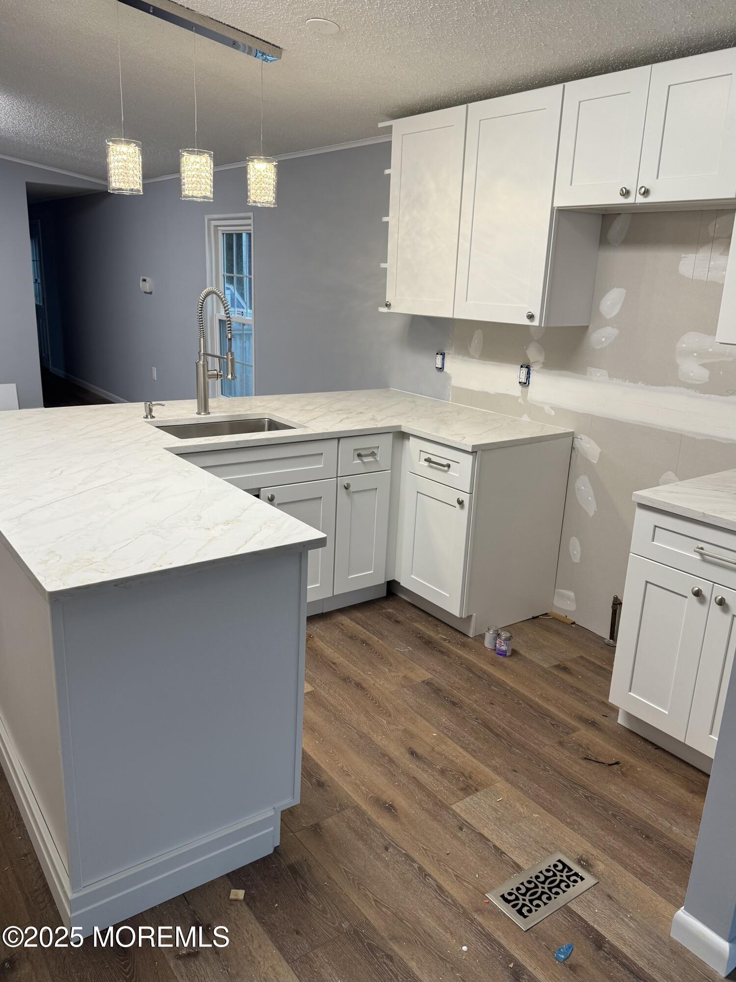 18 Ruffian Way Howell, NJ 07731 - Photo 4 of 9 a kitchen with a sink cabinets and wooden floor