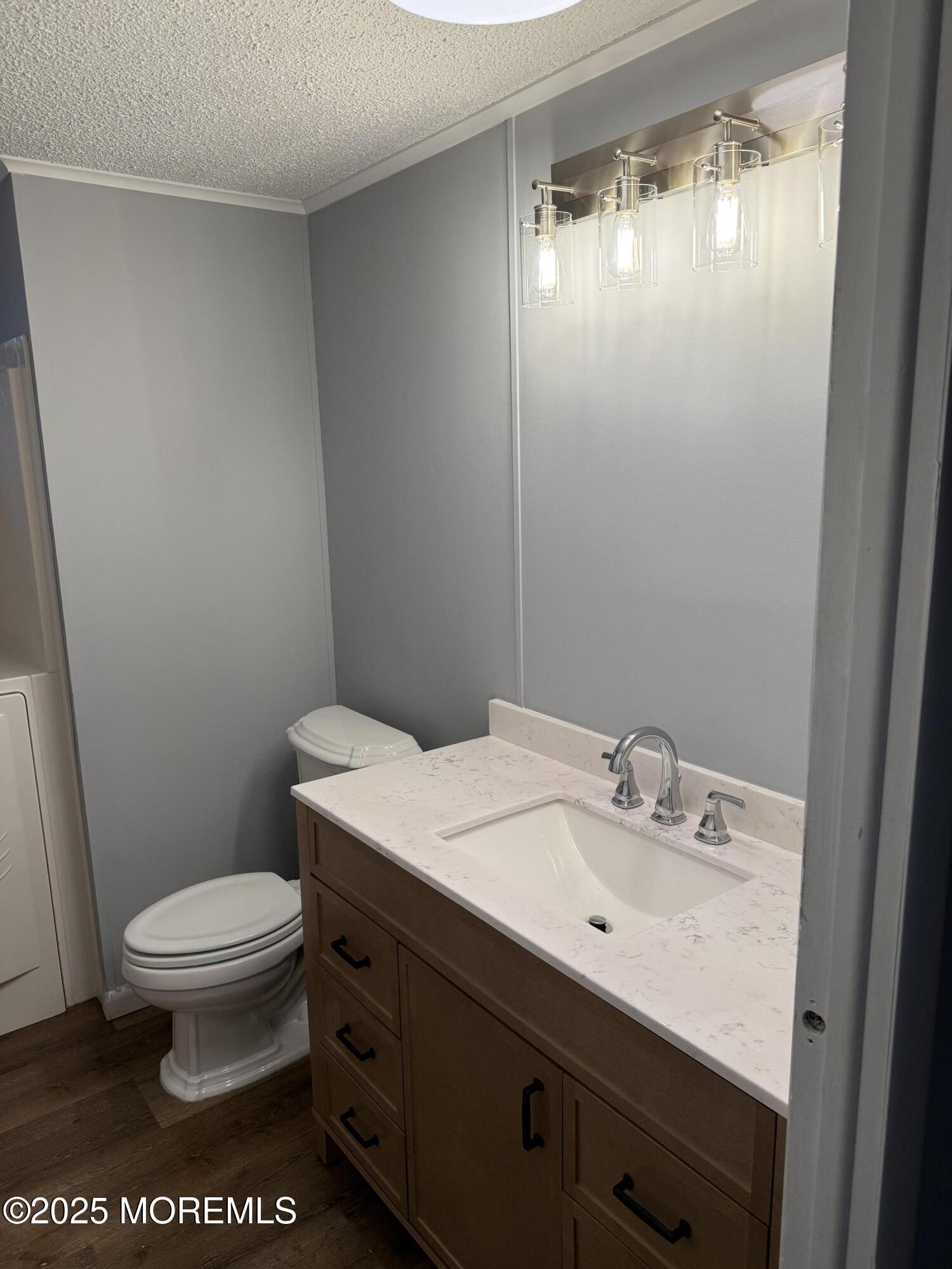 18 Ruffian Way Howell, NJ 07731 - Photo 6 of 9 a bathroom with a sink a toilet and mirror