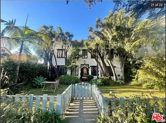 a view of swimming pool with sitting area and garden
