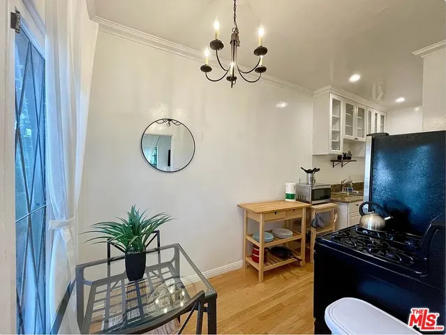 a kitchen with a table and chairs in it